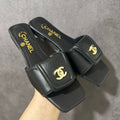 Chanel CC Turnlock Mules In Lambskin
